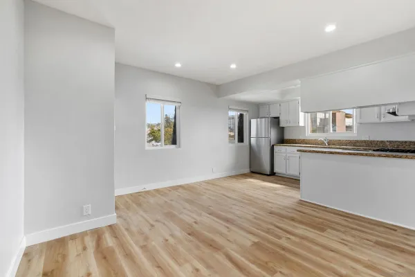 a view of a kitchen with a stove cabinets and wooden floor