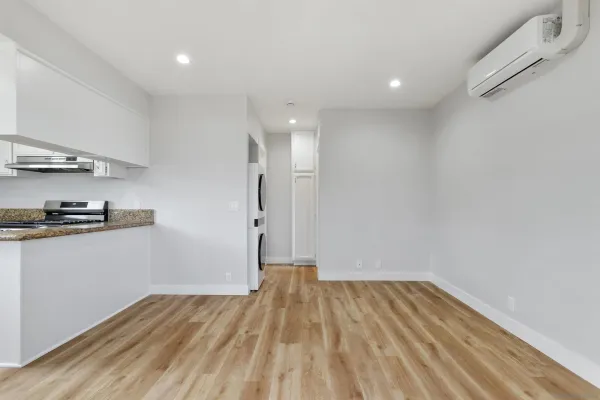 a view of kitchen with sink and wooden floor