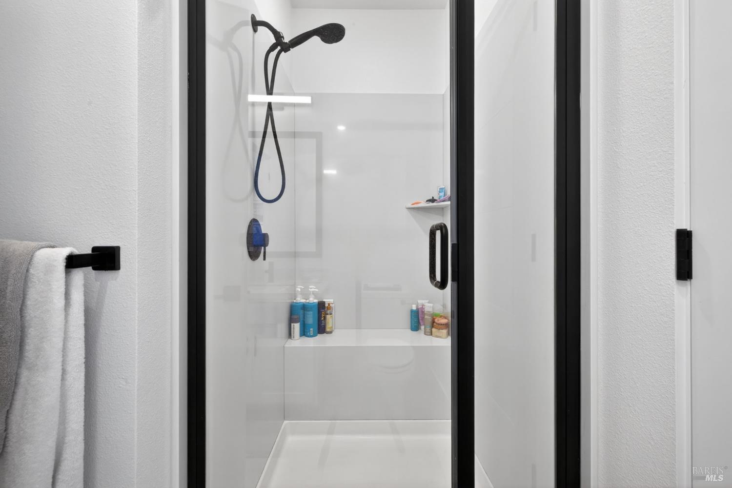 2215-2217 Versaro Drive Santa Rosa, CA 95403 - Photo 36 of 45 a bathroom with a glass shower door