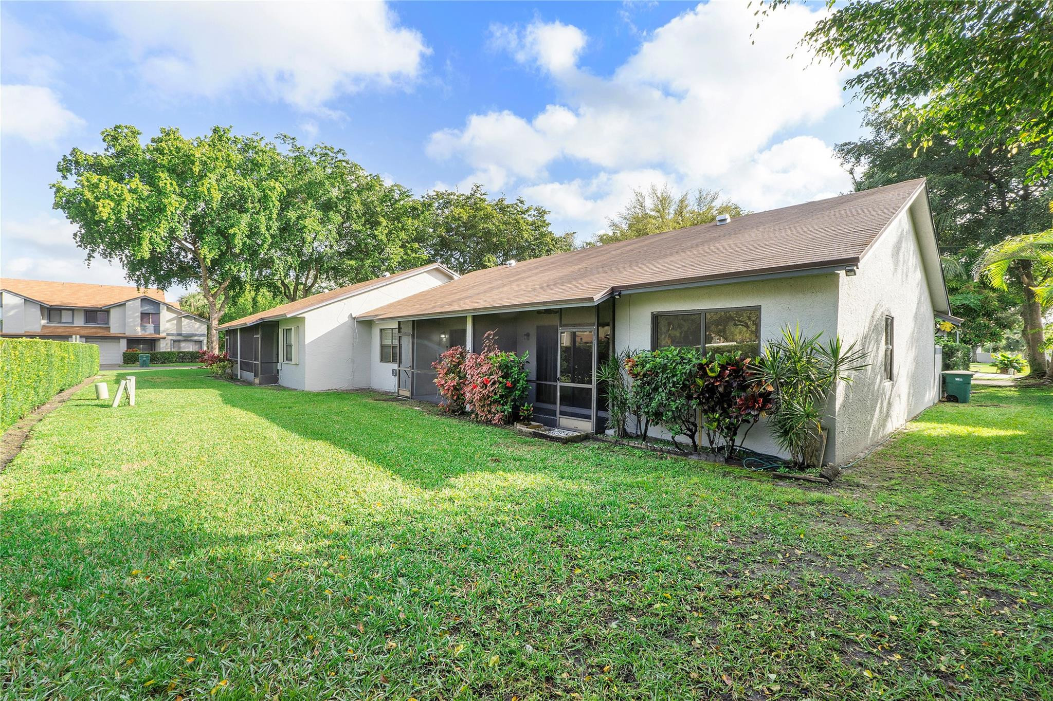 5290 Gate Lake Road, Unit 5290 Tamarac, FL 33319 - Photo 6 of 18 a view of a house with a yard and sitting area