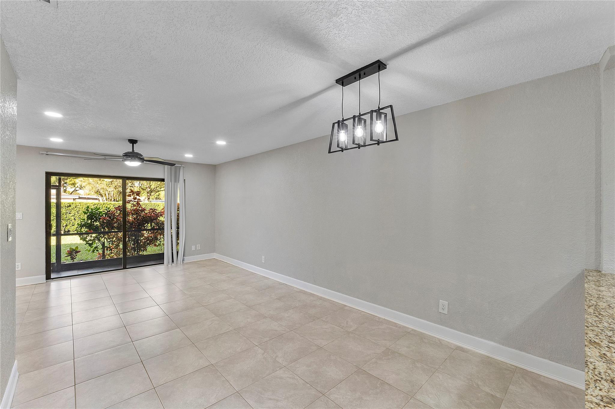 5290 Gate Lake Road, Unit 5290 Tamarac, FL 33319 - Photo 9 of 18 a view of an empty room and window