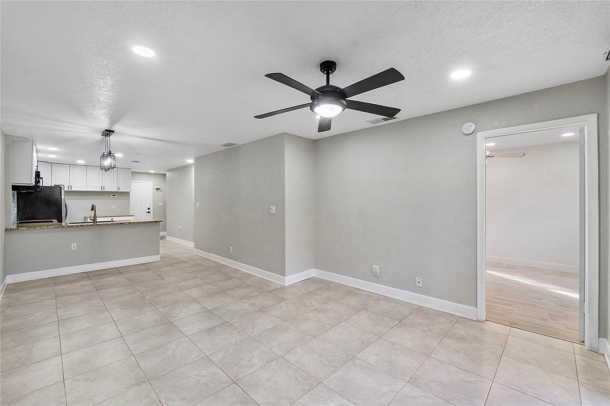 5290 Gate Lake Road, Unit 5290 Tamarac, FL 33319 - Photo 10 of 18 a view of a kitchen with a sink and a window