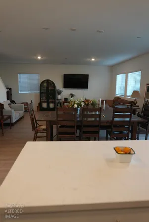 a living room with furniture and flat screen tv