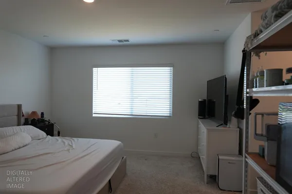 a bathroom with a toilet and a shower curtain