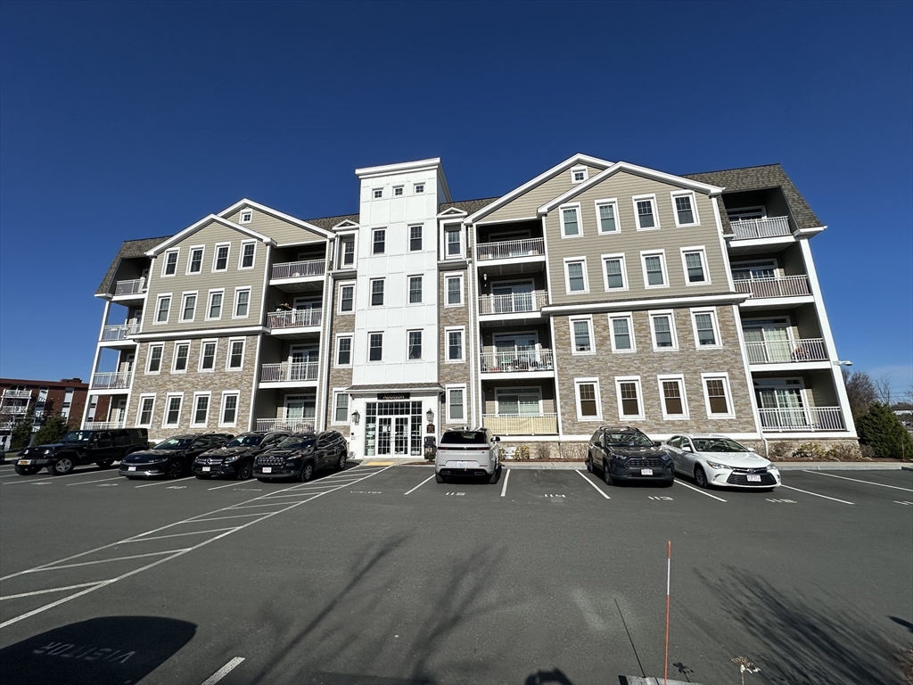 a front view of a building with street view