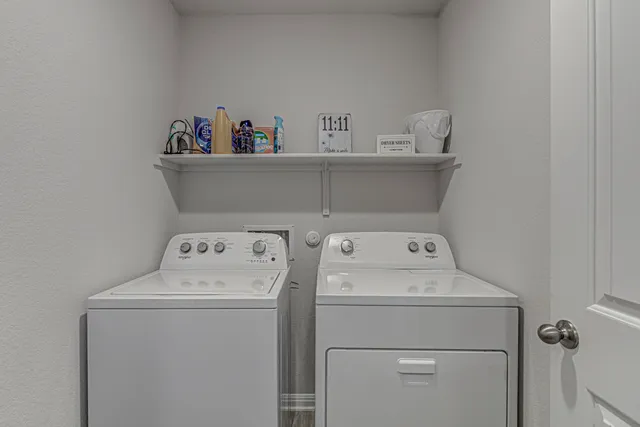 a utility room with dryer and washer