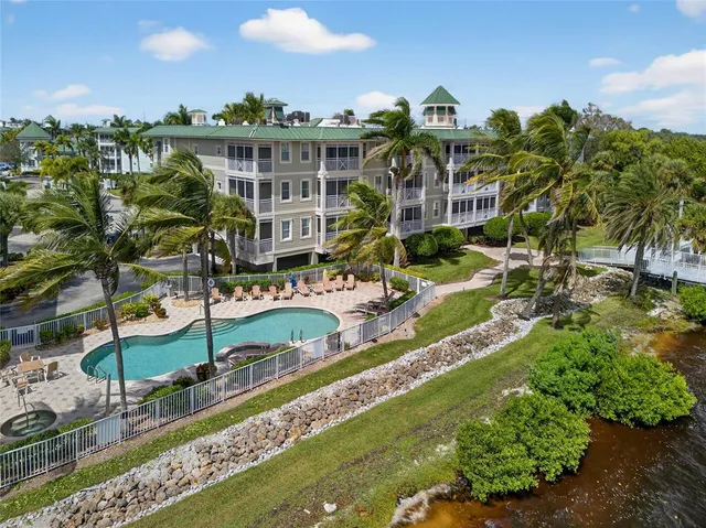 a view of building with outdoor space and swimming pool