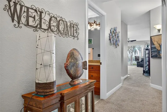 a view of hall way with furniture