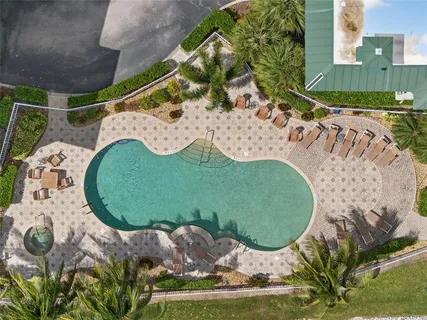 a vase of flowers sitting on a floor