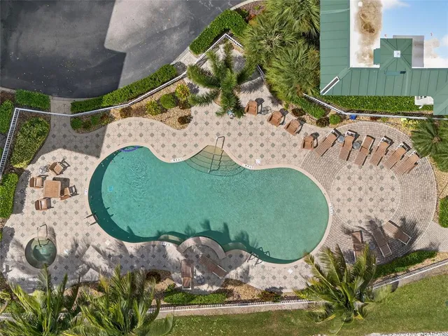 a vase of flowers sitting on a floor