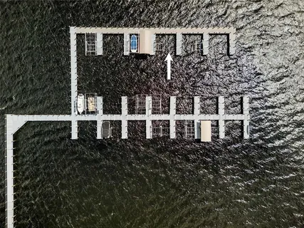 a view of a pathway with a wrought fence