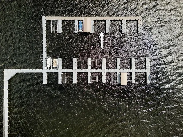 a view of a pathway with a wrought fence