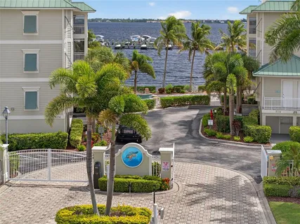 a front view of a house with garden and outdoor seating