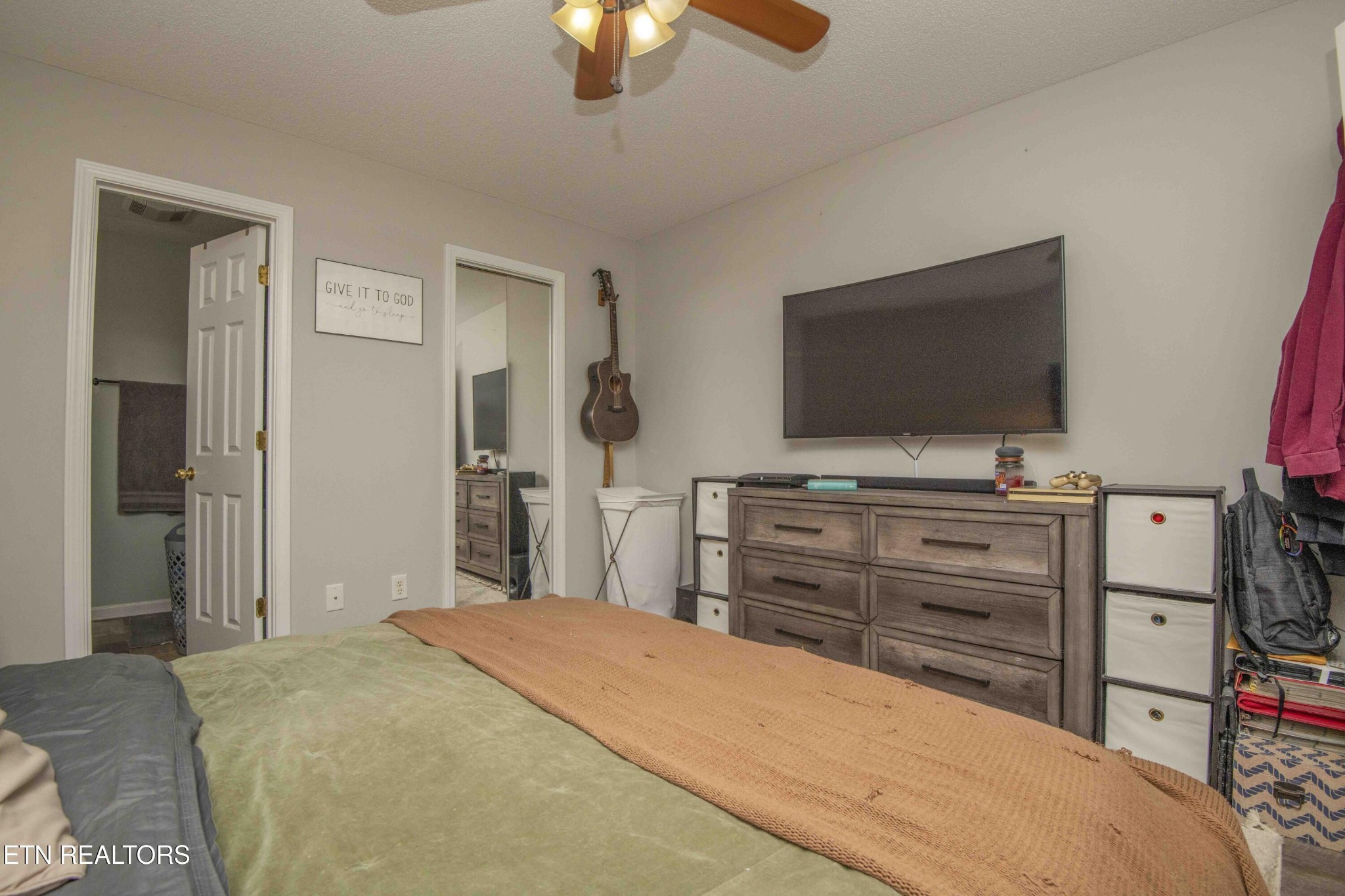 7533 Gary White Road Corryton, TN 37721 - Photo 26 of 44 a bedroom with a bed and a flat screen tv