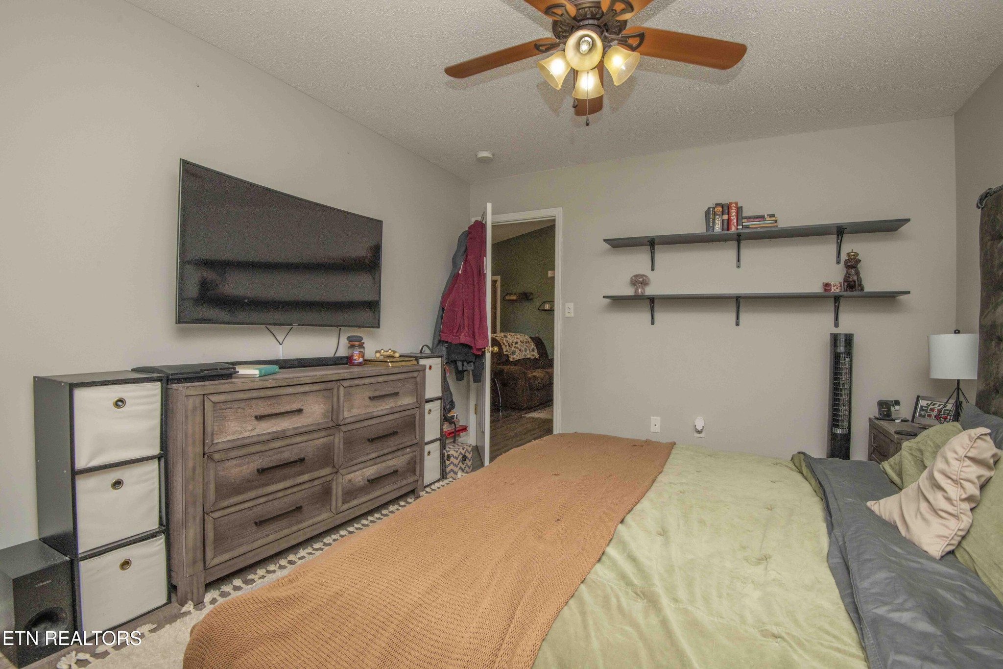 7533 Gary White Road Corryton, TN 37721 - Photo 28 of 44 a bedroom with a bed and a flat screen tv