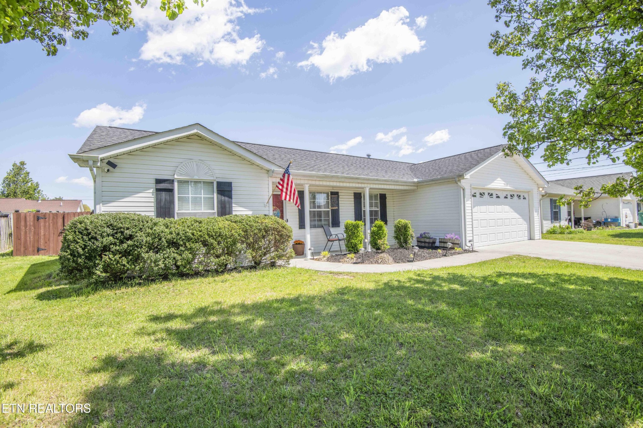7533 Gary White Road Corryton, TN 37721 - Photo 3 of 44 a front view of a house with yard and green space