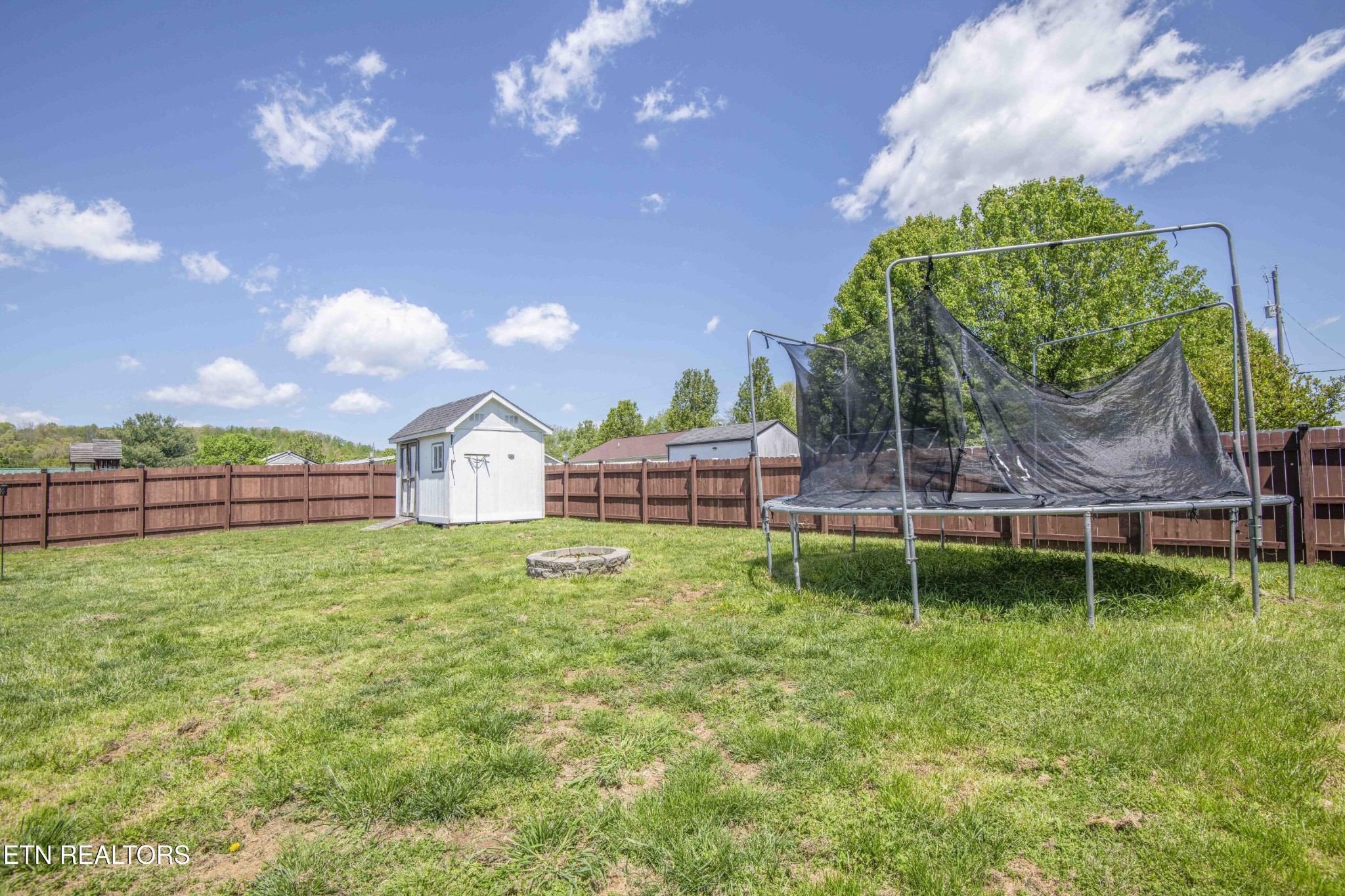 7533 Gary White Road Corryton, TN 37721 - Photo 39 of 44 a backyard of a house with lots of green space table and chairs
