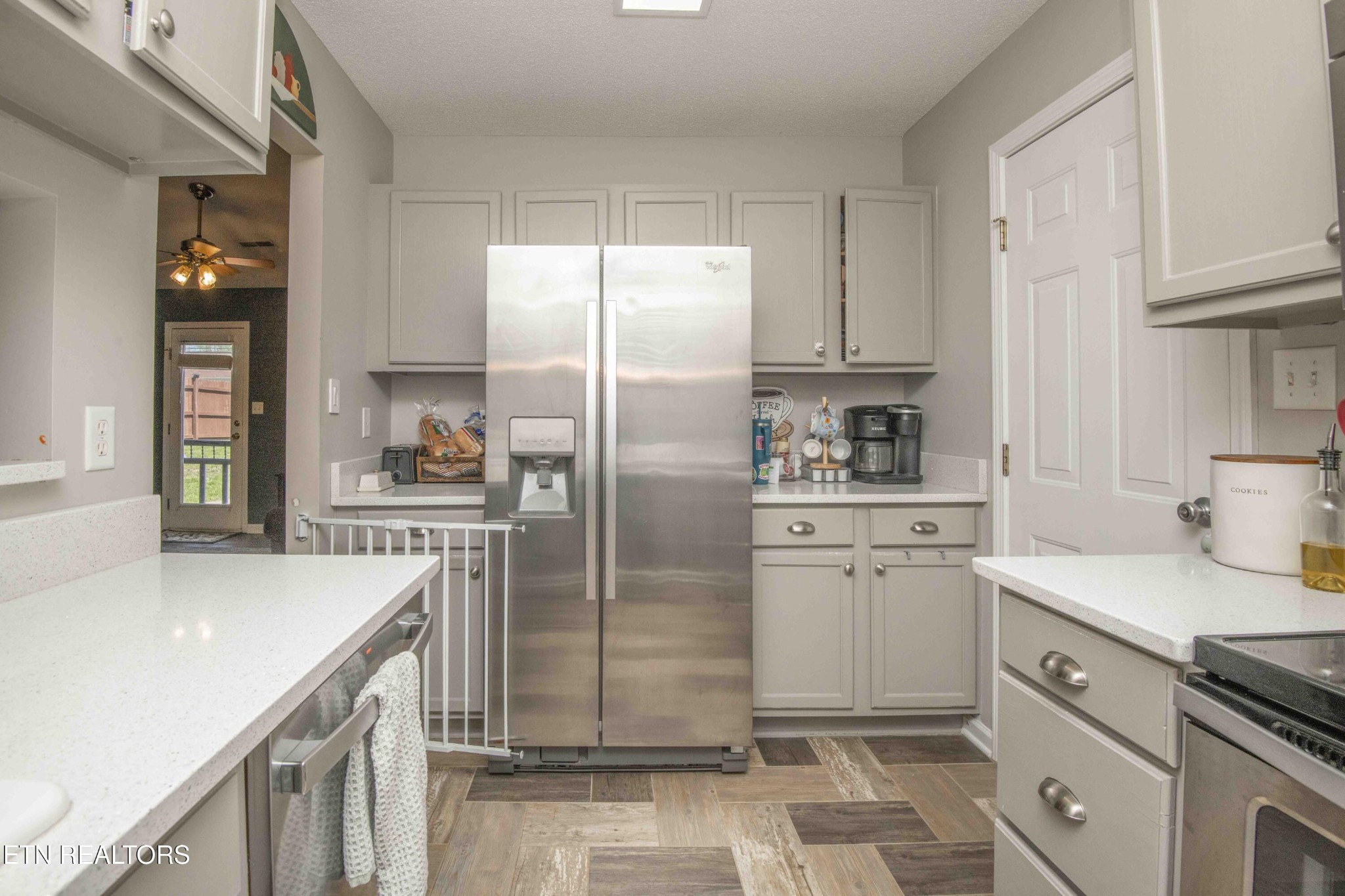 7533 Gary White Road Corryton, TN 37721 - Photo 10 of 44 a kitchen with a refrigerator sink and cabinets