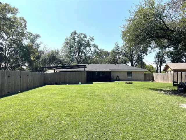 a swimming pool with wooden fence