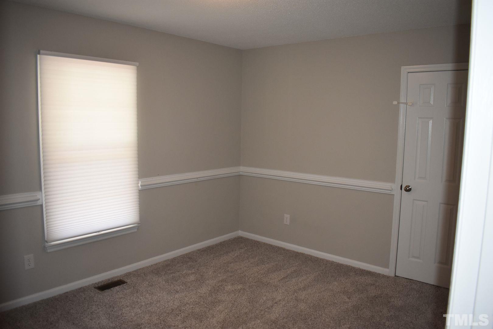 614 Mc Kay Street Erwin, NC 28339 - Photo 11 of 24 an empty room with a window