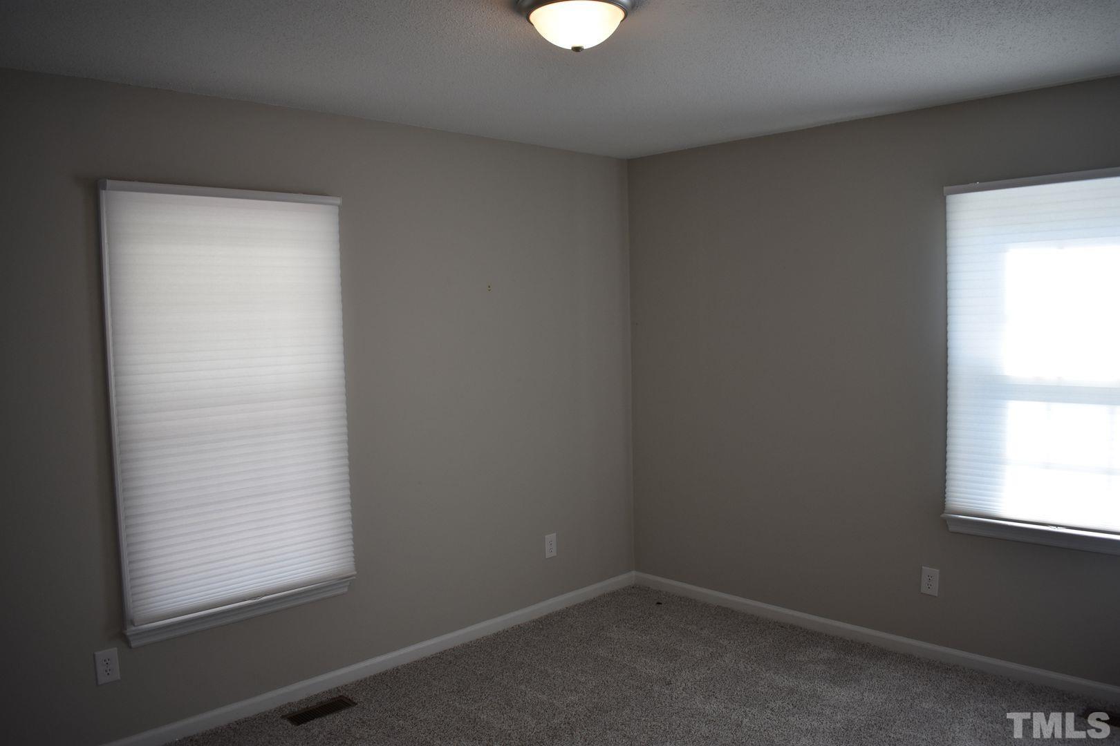 614 Mc Kay Street Erwin, NC 28339 - Photo 12 of 24 an empty room with a window