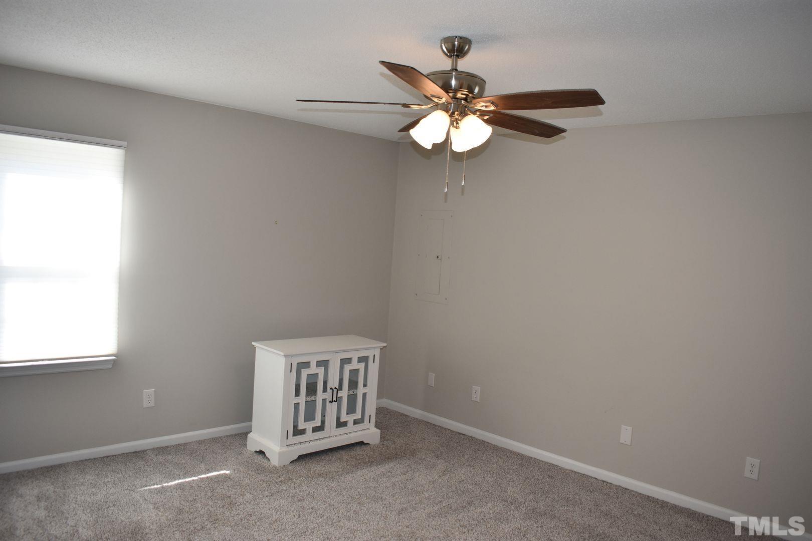 614 Mc Kay Street Erwin, NC 28339 - Photo 16 of 24 an empty room with windows and fan