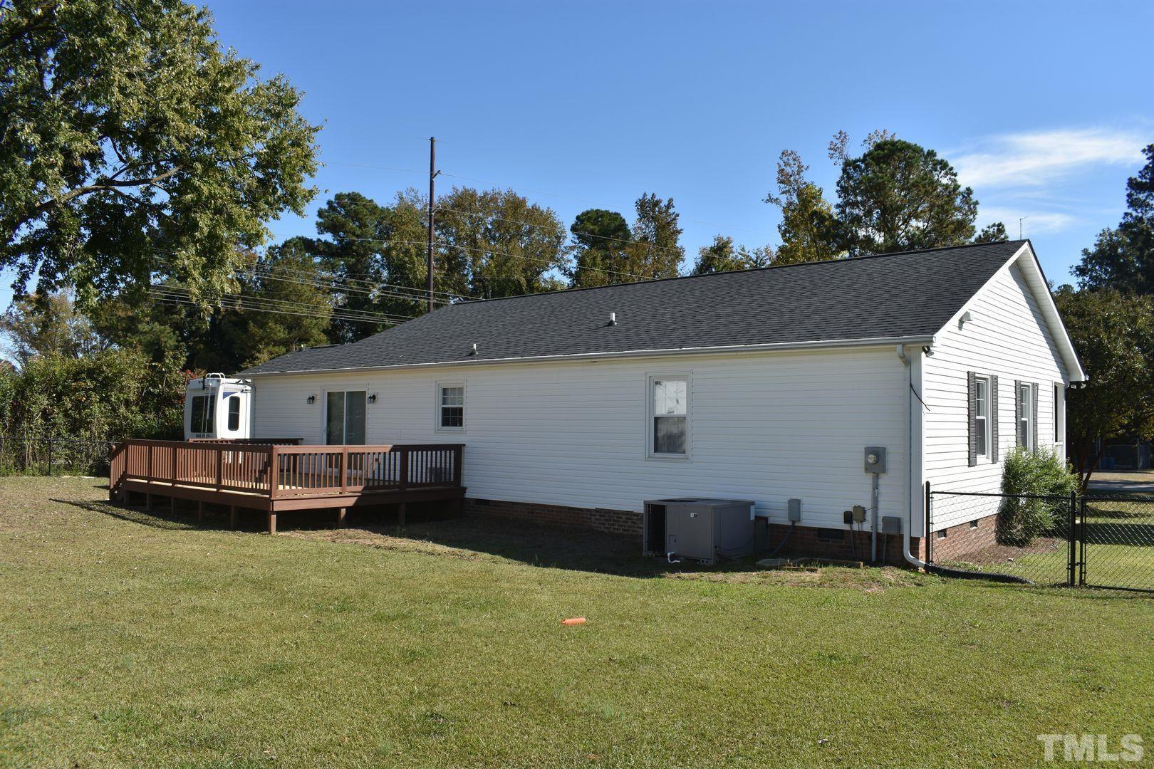 614 Mc Kay Street Erwin, NC 28339 - Photo 21 of 24 a backyard of a house with table and chairs
