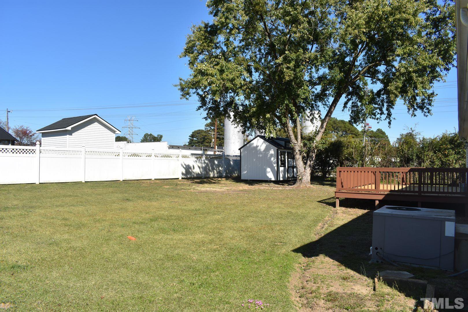 614 Mc Kay Street Erwin, NC 28339 - Photo 22 of 24 a view of a lake with a yard