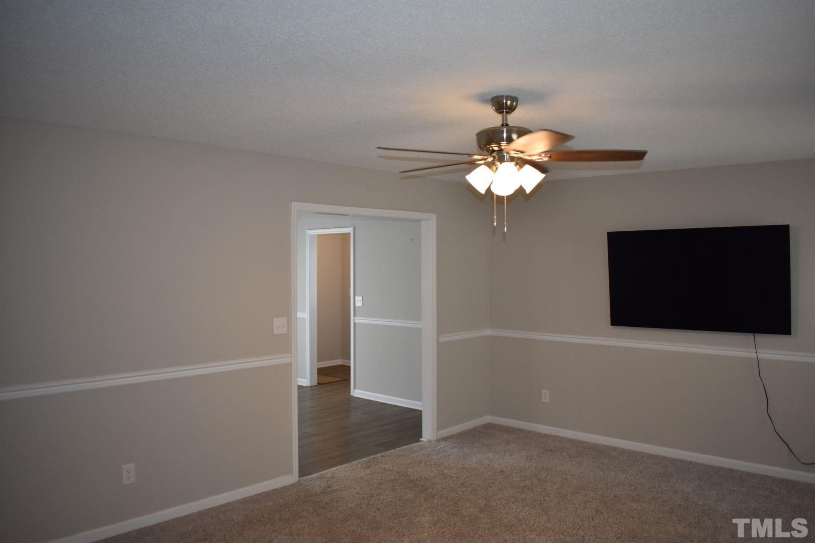 614 Mc Kay Street Erwin, NC 28339 - Photo 5 of 24 an empty room with a window