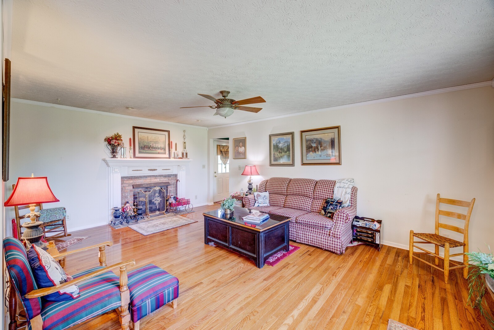 7486 Deer Ridge Road Primm Springs, TN 38476 - Photo 12 of 69 a living room with furniture and a wooden floor