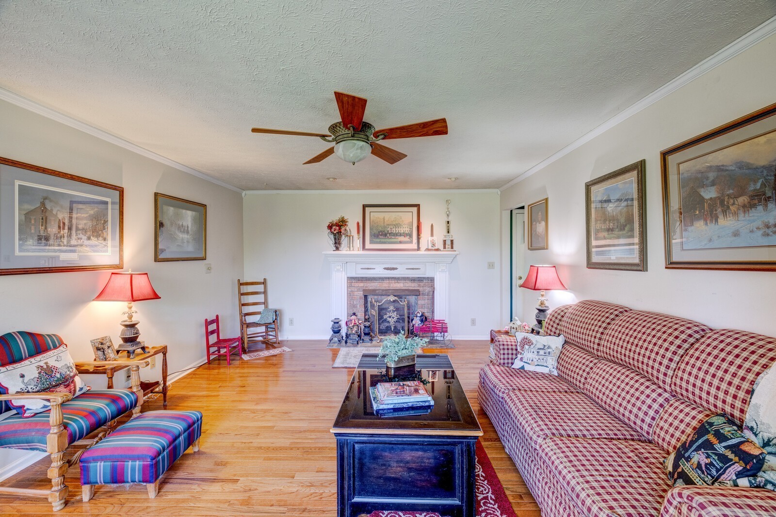 7486 Deer Ridge Road Primm Springs, TN 38476 - Photo 14 of 69 a living room with furniture a flat screen tv and a dining table