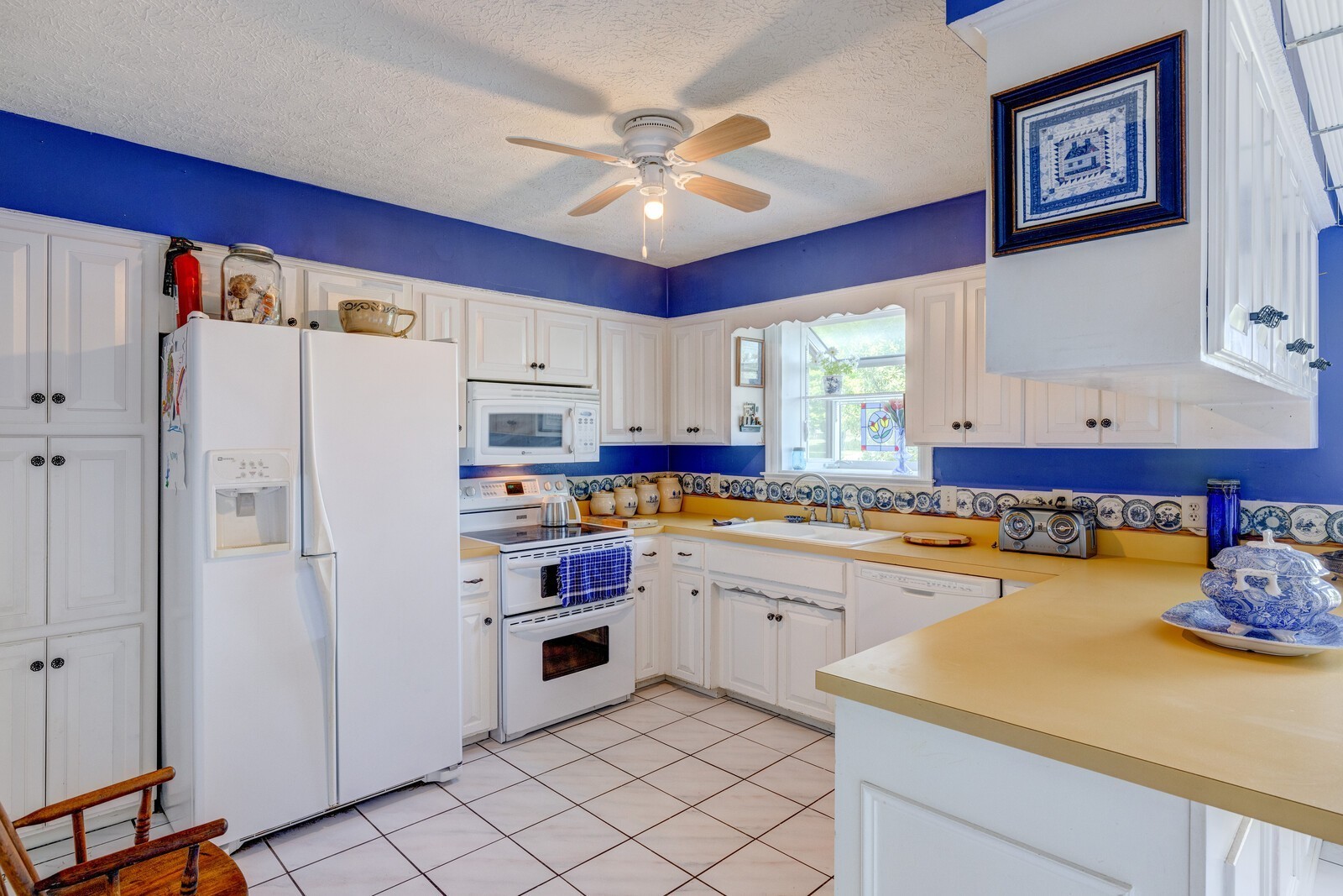 7486 Deer Ridge Road Primm Springs, TN 38476 - Photo 22 of 69 a kitchen with stainless steel appliances a stove a refrigerator and a refrigerator