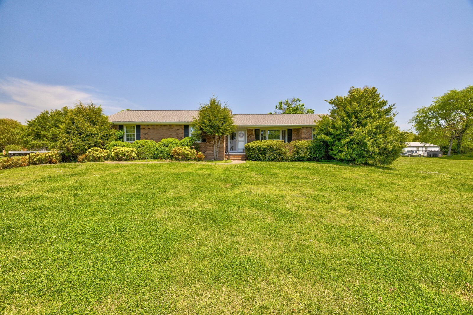 7486 Deer Ridge Road Primm Springs, TN 38476 - Photo 4 of 69 a front view of a house with a yard