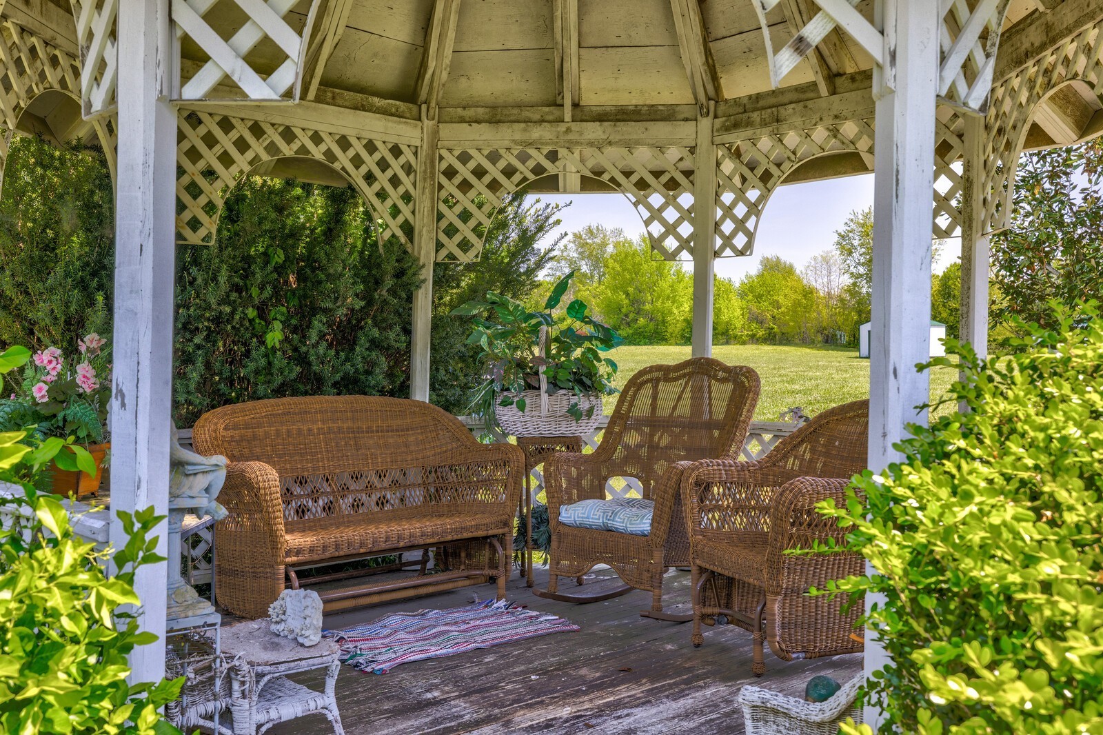 7486 Deer Ridge Road Primm Springs, TN 38476 - Photo 49 of 69 a view of a patio with table and chairs potted plants