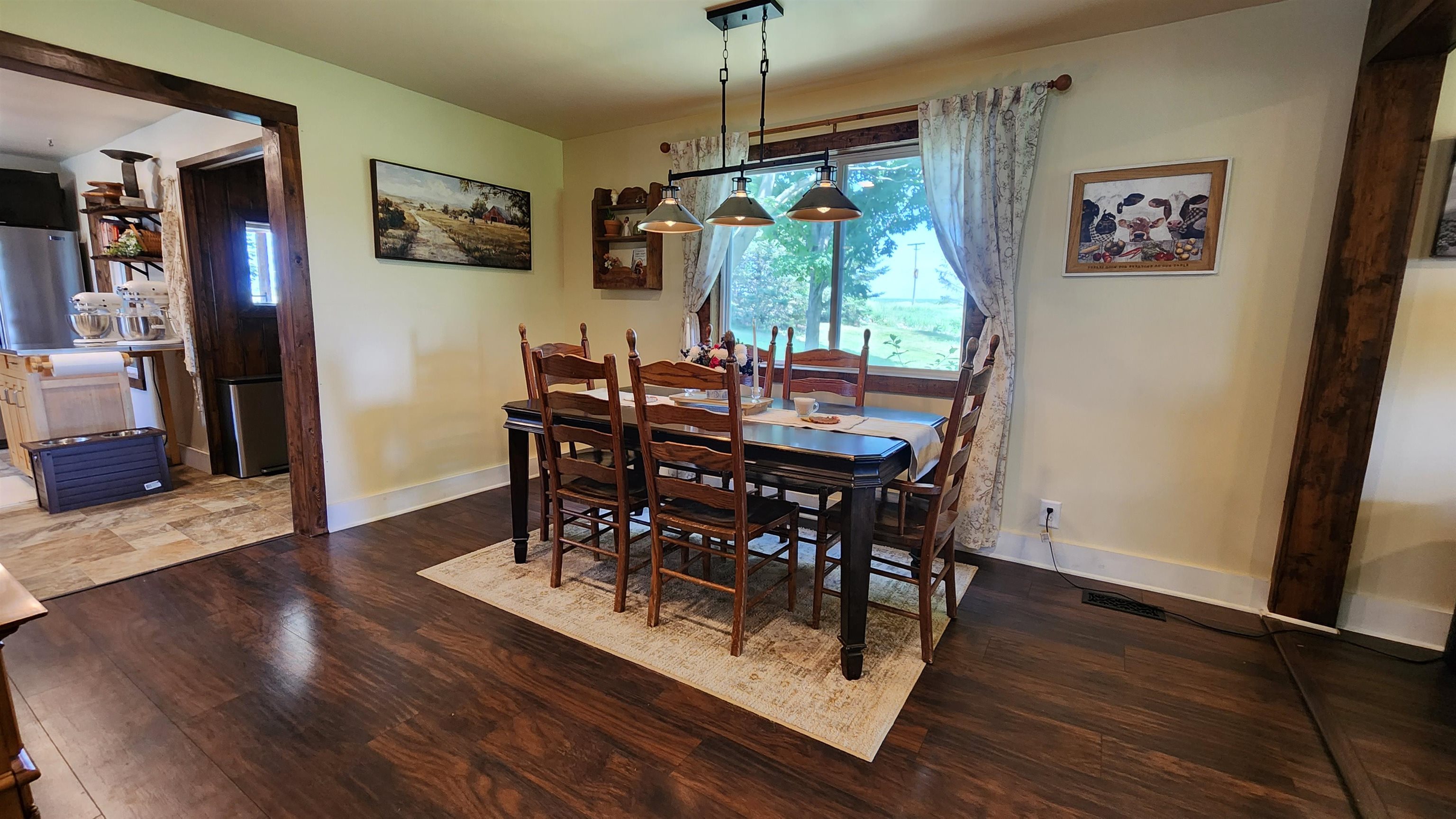8999 Centerville Road Capron, IL 61012 - Photo 15 of 69 a view of a dining room with furniture window and wooden floor
