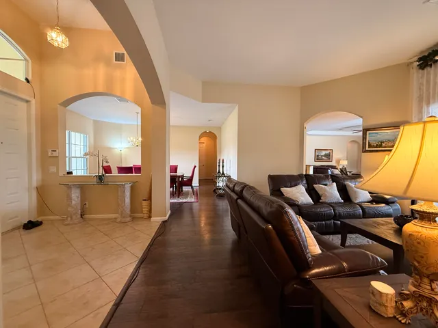 a kitchen with stainless steel appliances kitchen island granite countertop a sink and cabinets