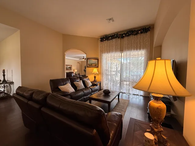 a view of a dining room with furniture and chandelier