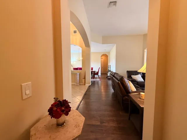 a living room with furniture window and wooden floor
