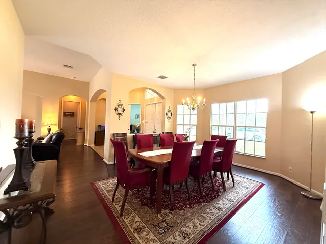 a kitchen with stainless steel appliances a stove top oven and a refrigerator