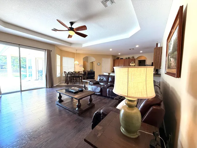 a spacious bathroom with a double vanity sink a mirror and a bathtub