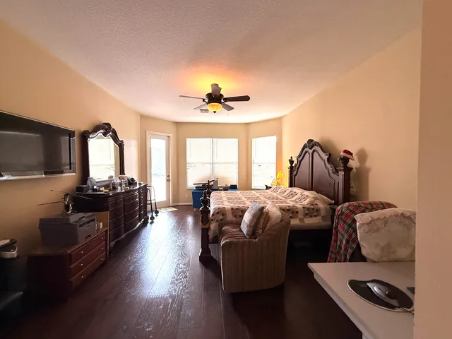 a view of a livingroom with workspace and a window
