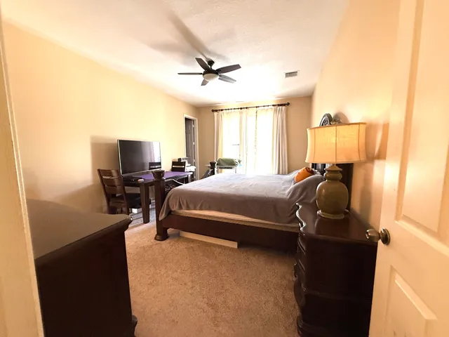 a bedroom with a bed and a cabinets