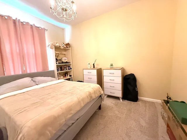 a spacious bathroom with a double vanity sink and a mirror