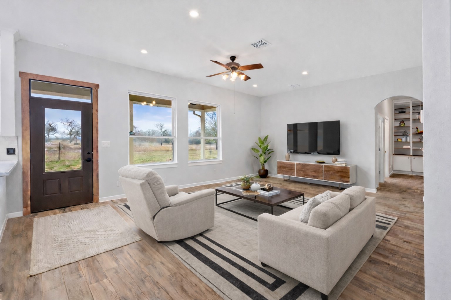 28322 Mellman Road Hempstead, TX 77445 - Photo 13 of 50 This living room is open to the kitchen area, great for entertaining.