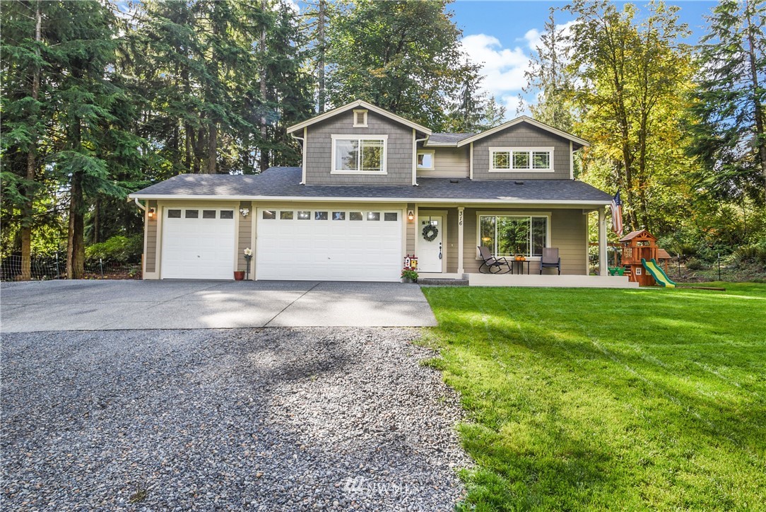 316 West Shore Loop Road Snohomish, WA 98290 - Photo 1 of 1 a front view of a house with garden