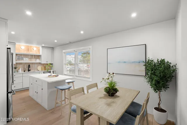 a kitchen with a table and chairs in it