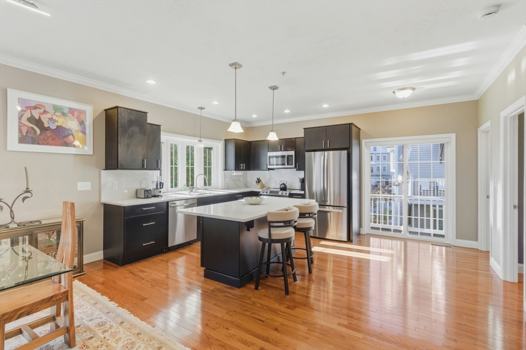 66 Compass Point, Unit 66 North Andover, MA 01845 - Photo 13 of 42 a large kitchen with a table and chairs
