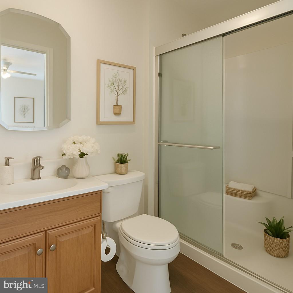 209 Warfield Road Newark, DE 19713 - Photo 11 of 18 a bathroom with a granite countertop sink mirror vanity and toilet
