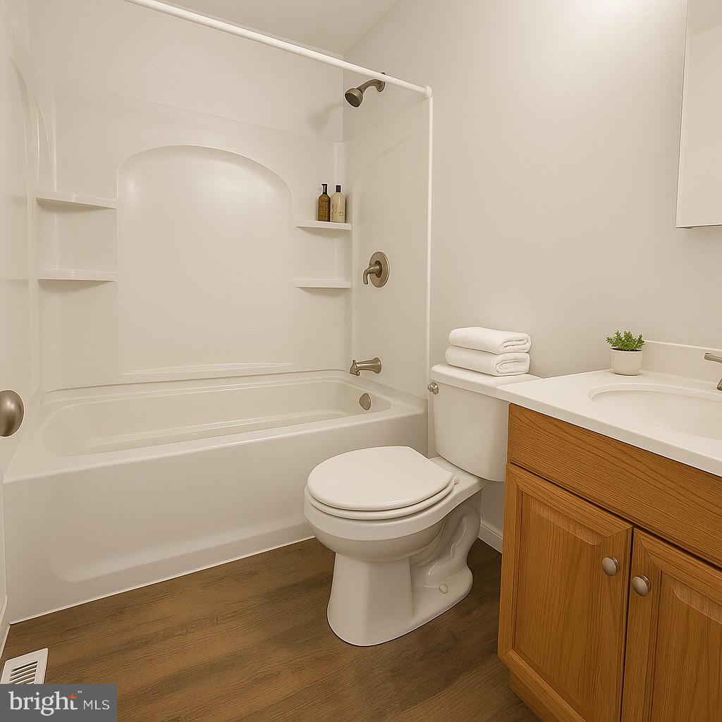 209 Warfield Road Newark, DE 19713 - Photo 14 of 18 a bathroom with a sink a toilet and shower