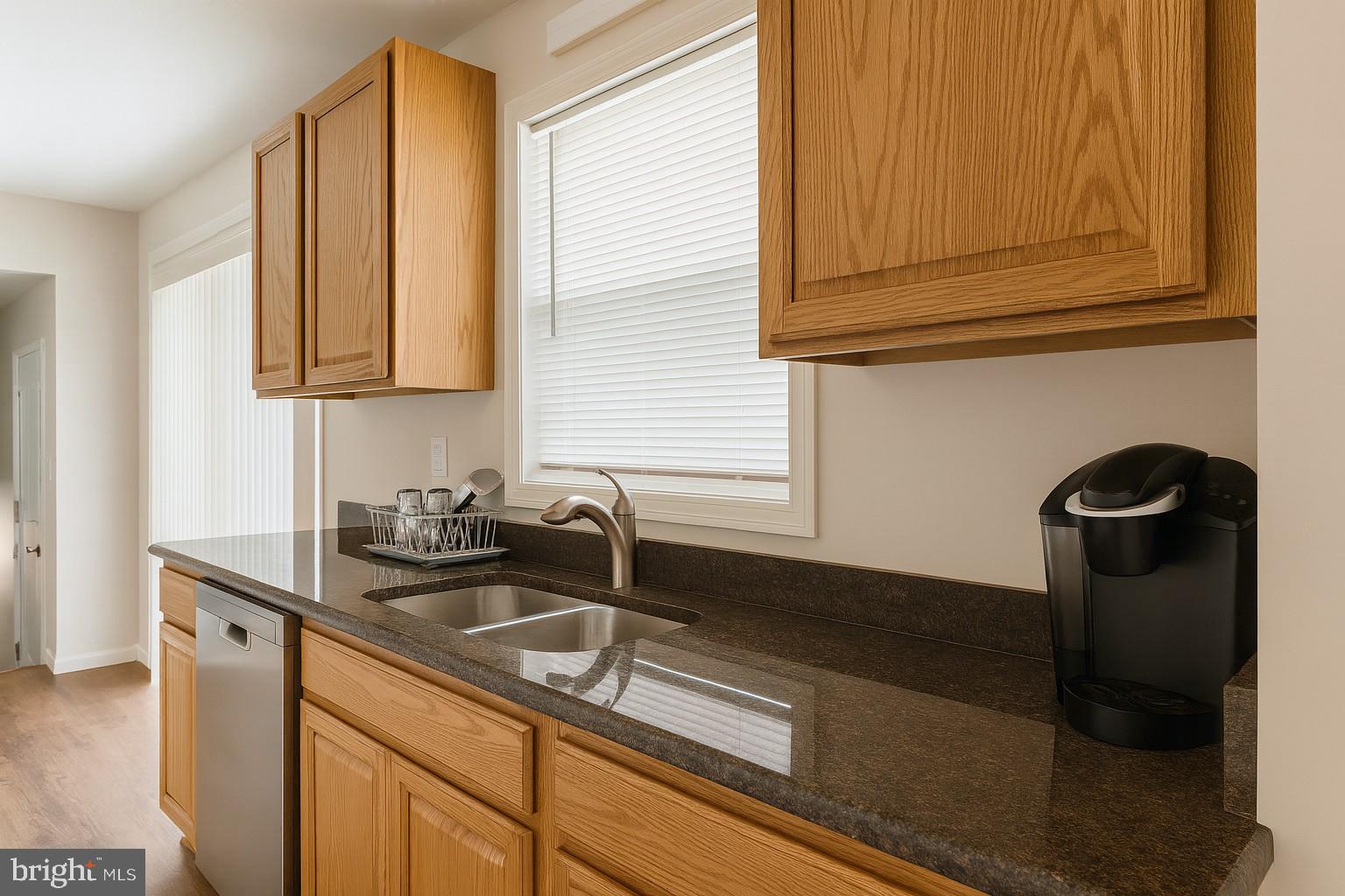 209 Warfield Road Newark, DE 19713 - Photo 7 of 18 a kitchen with a sink and cabinets